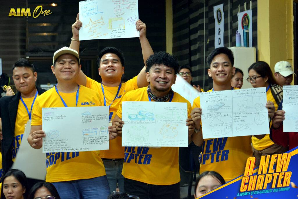 Members holding up their completed worksheets